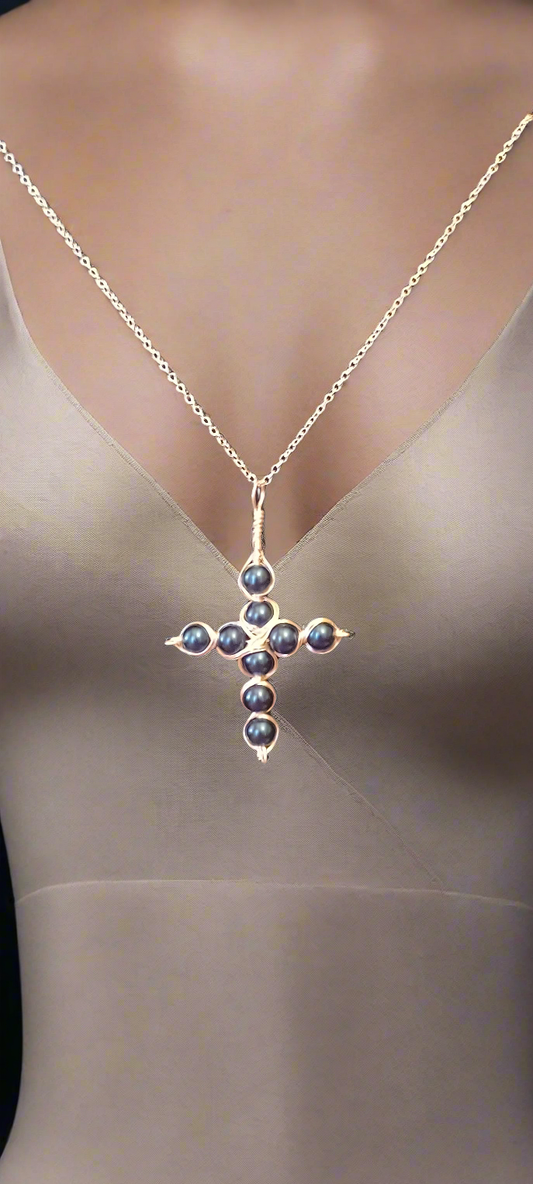 Blue glass bead cross necklace with 23" silver chain